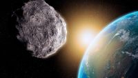 An illustration of a large rock floating in space with Earth in the background