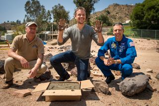Matt Damon Makes Hand Prints at JPL