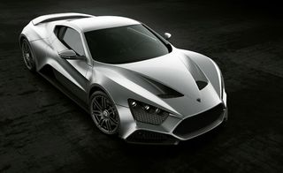 Silver Zenvo ST1 supercar against a black background