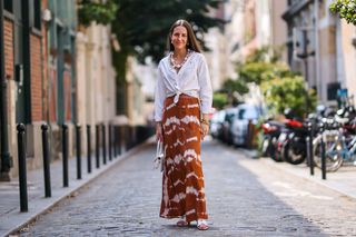 woman in maxi skirt and white shirt