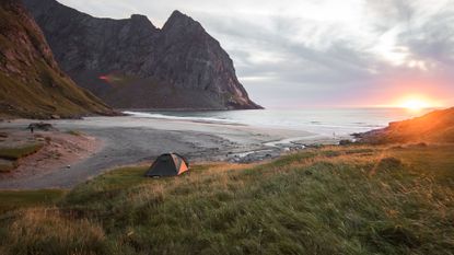 best backpacking tent: A backpacking tent pitched on a scenic coastal spot