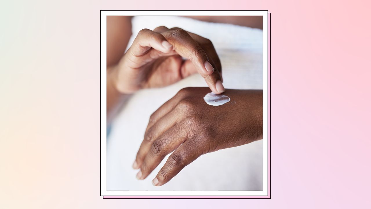 close up of woman&#039;s hands applying moisturizer or sunscreen