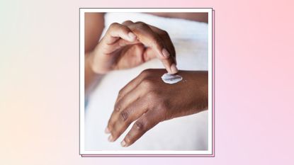 close up of woman's hands applying moisturizer or sunscreen 