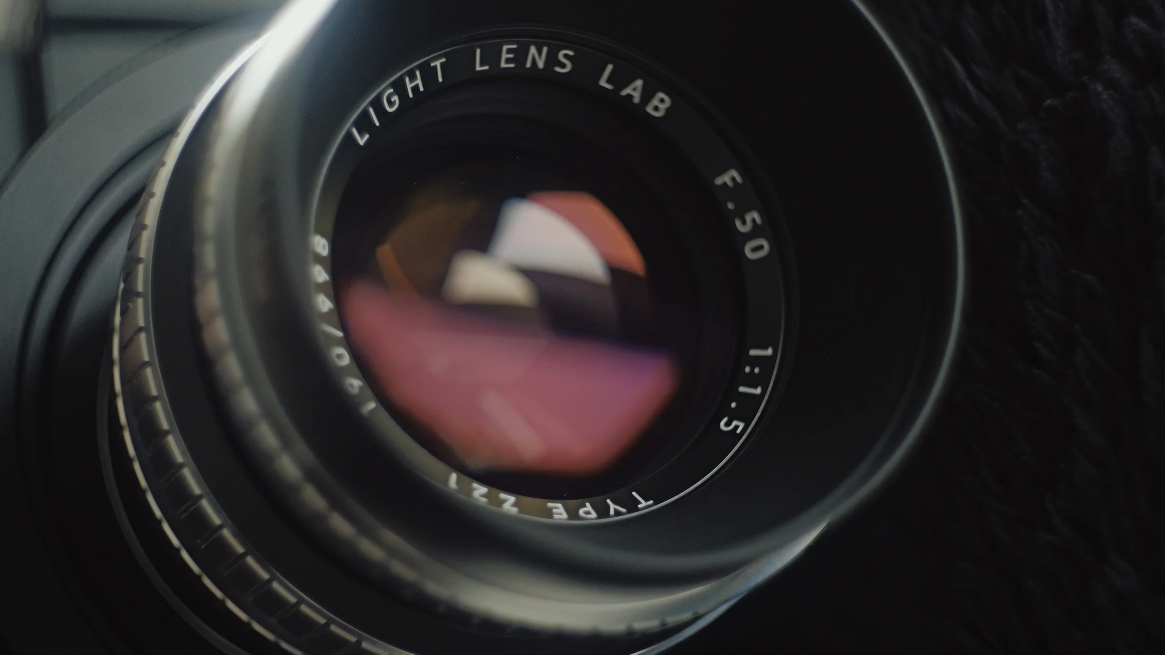 Close-up of a camera lens, Light Lens Lab 50mm f/1.5, highlighting its glass elements and intricate details