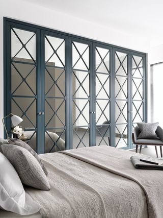 how to make a tiny apartment feel bigger with mirrored wardrobes