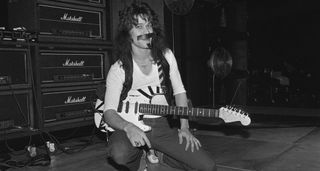 A black-and-white image of Eddie Van Halen in '78 with his soon-to-be modded Frankenstrat