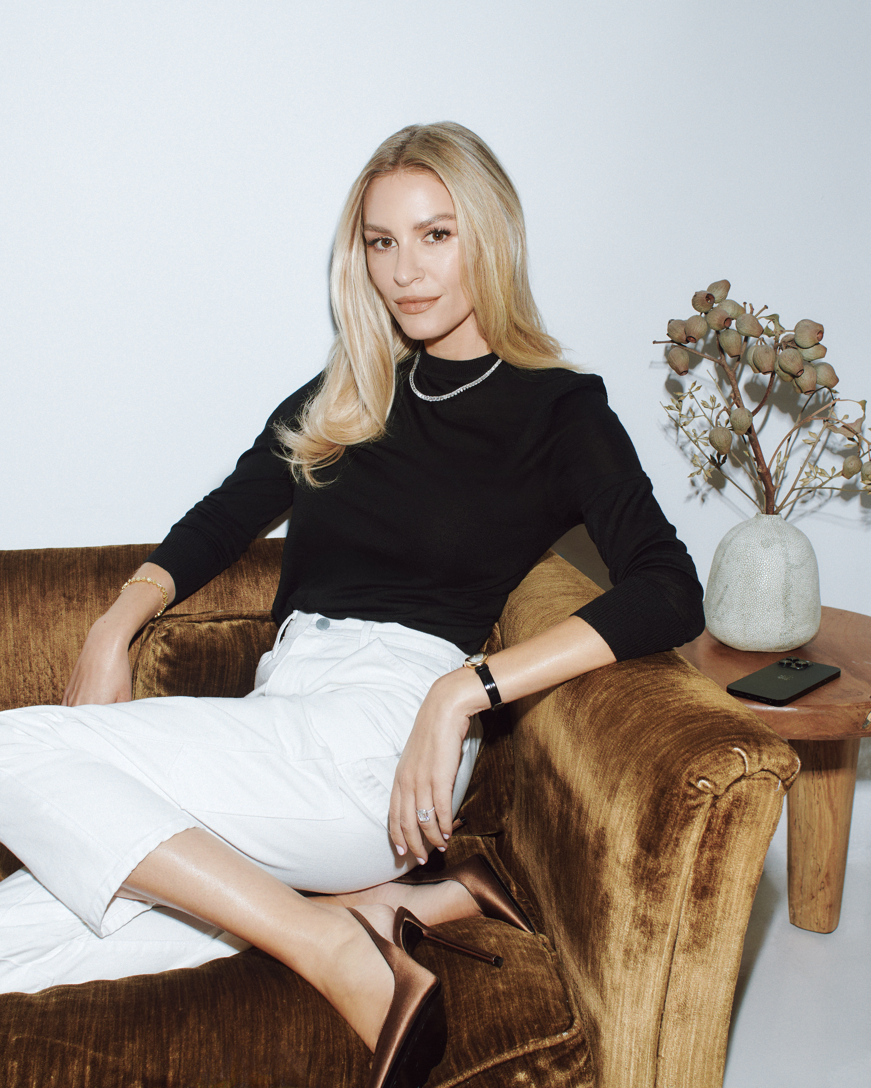 Photo of Morgan Stewart McGraw sitting on a couch