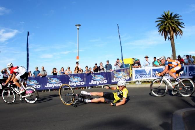 A rider slides out on the first corner