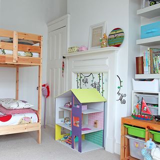 children's bedroom with white wall and dall house