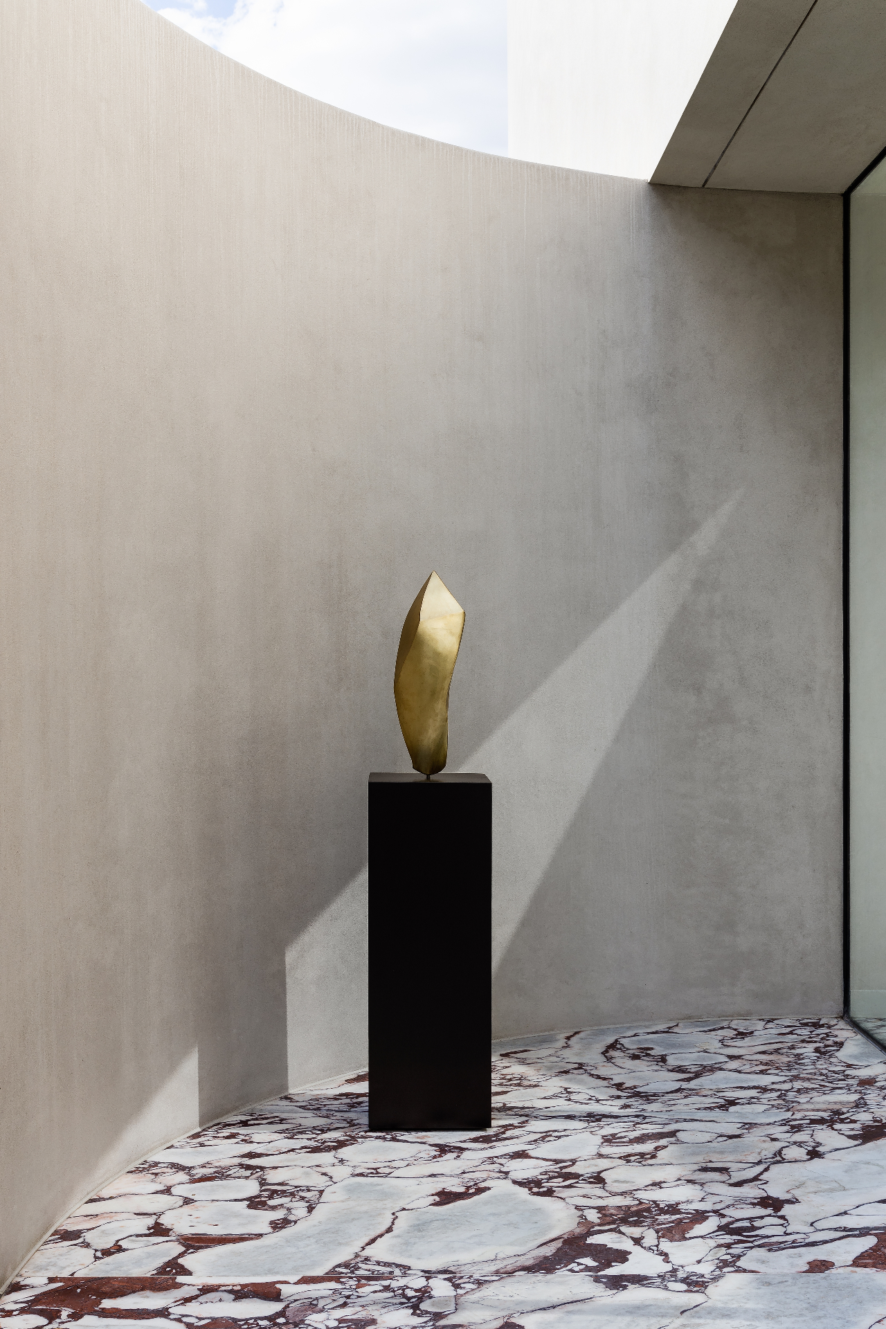 gold scultpure on a black surface