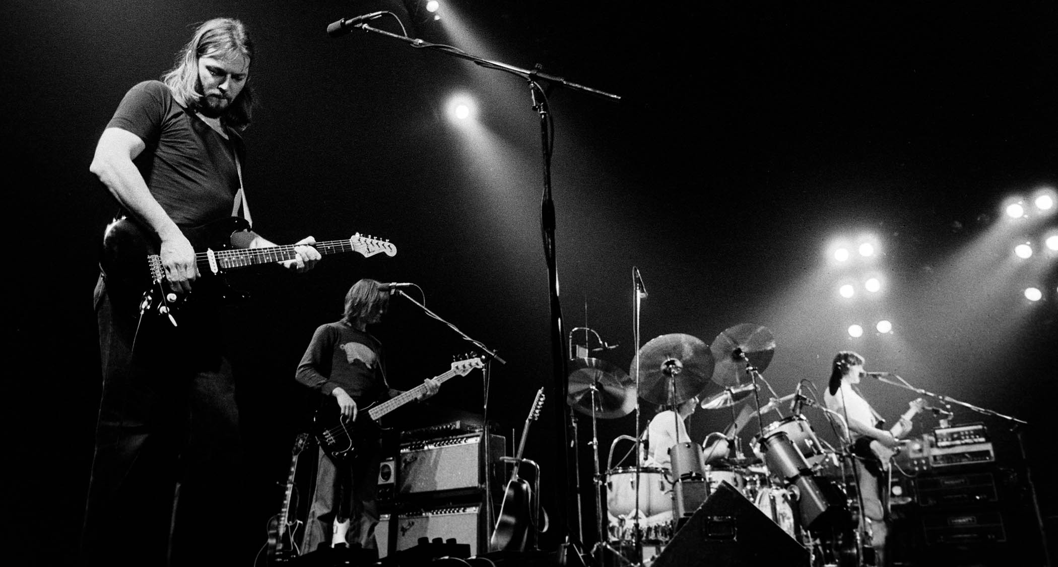Pink Floyd live in 1977, with David Gilmour playing his Black Strat on the far left of the picture.