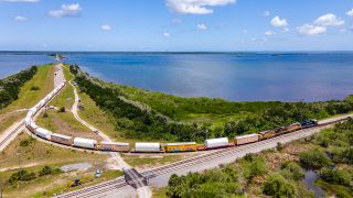In addition to the fueled segments for Artemis 1, two inert common booster segments for Northrop Grumman's OmegA rocket also arrived in Florida by train, riding on red cars.
