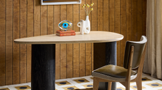 Wooden paneled home office with aysmmetrical double pedestal table
