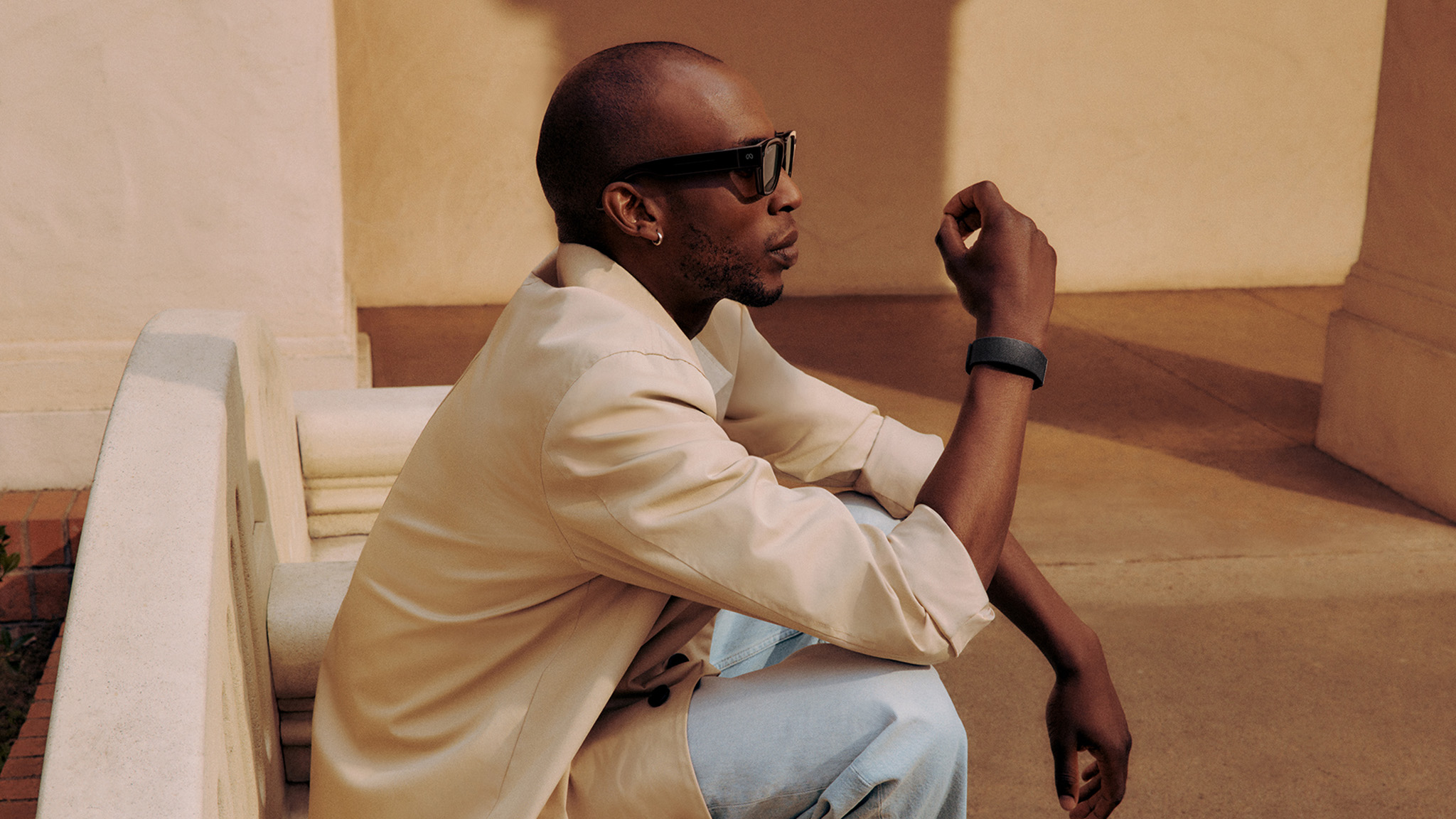 An official lifestyle shot of someone wearing Meta Ray-Ban Display Glasses