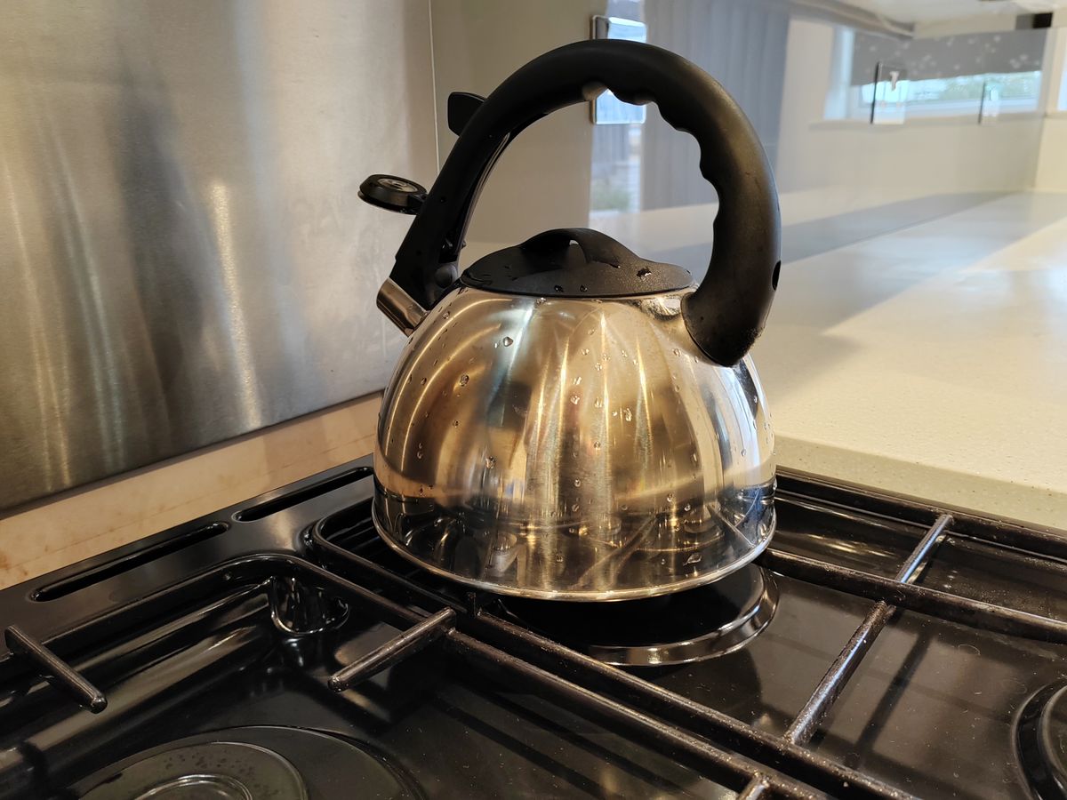 A silver kettle on a hob, picture taken with an Honor 70 camera