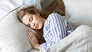 Women sleeping in pajamas in bed