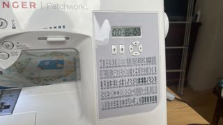 Singer Patchwork 7285Q review; close up of a sewing machine's control panel