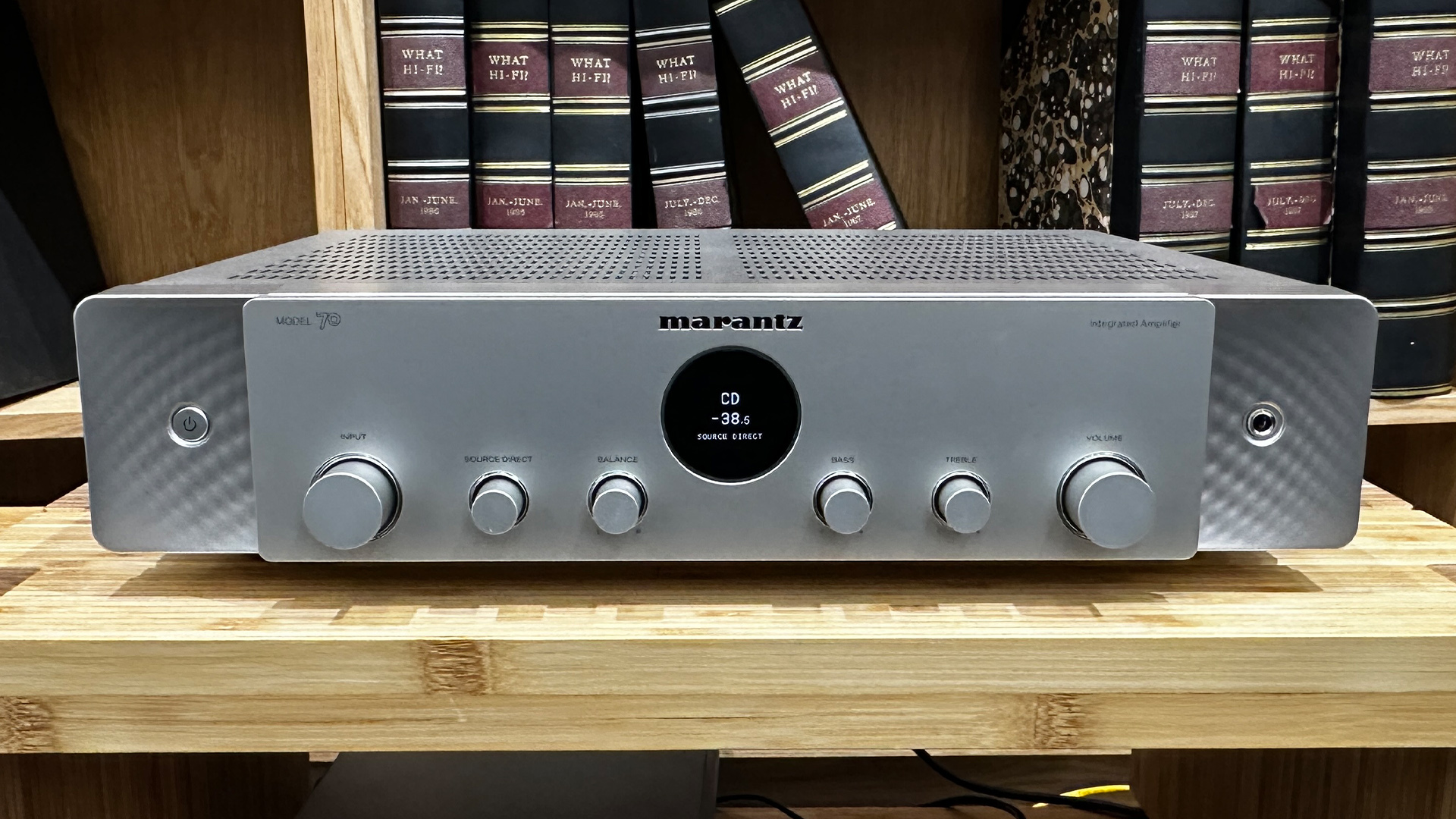 Marantz Model 70 integrated amplifier on wooden hi-fi rack in front of bookcase