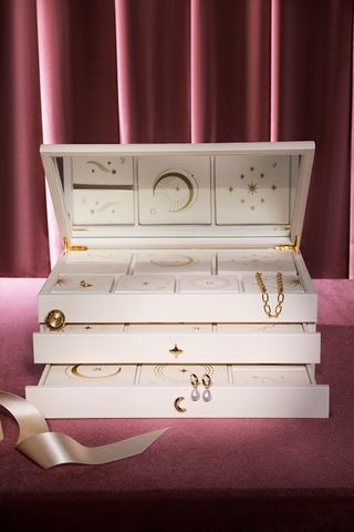 Astrid & Miyu cream jewellery box advent calendar with gold jewellery behind each door