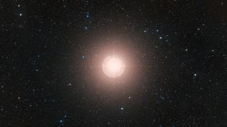 This image of Betelgeuse is a color composite made from exposures from the Digitized Sky Survey 2 (DSS2). A bright ball of light glows in the middle of deep space
