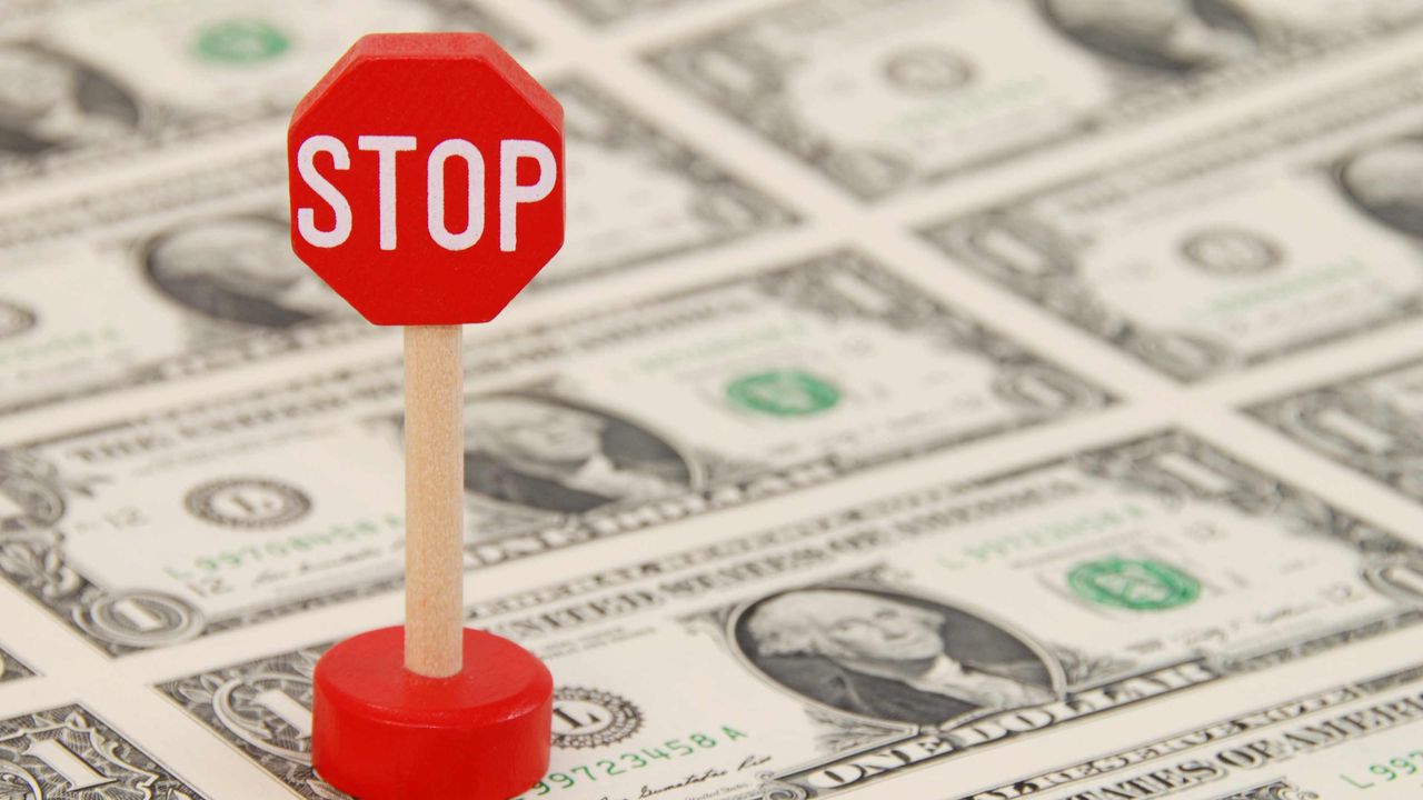 picture of a small stop sign on money