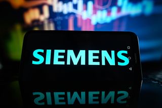 Siemens logo pictured on a smartphone with blue background