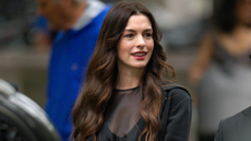 Anne Hathaway on set for The Devil Wears Prada 2 in a black sheer dress