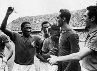 Djalma Santos celebrates with Pele ad Gilmar after winning the 1958 World Cup with Brazil.