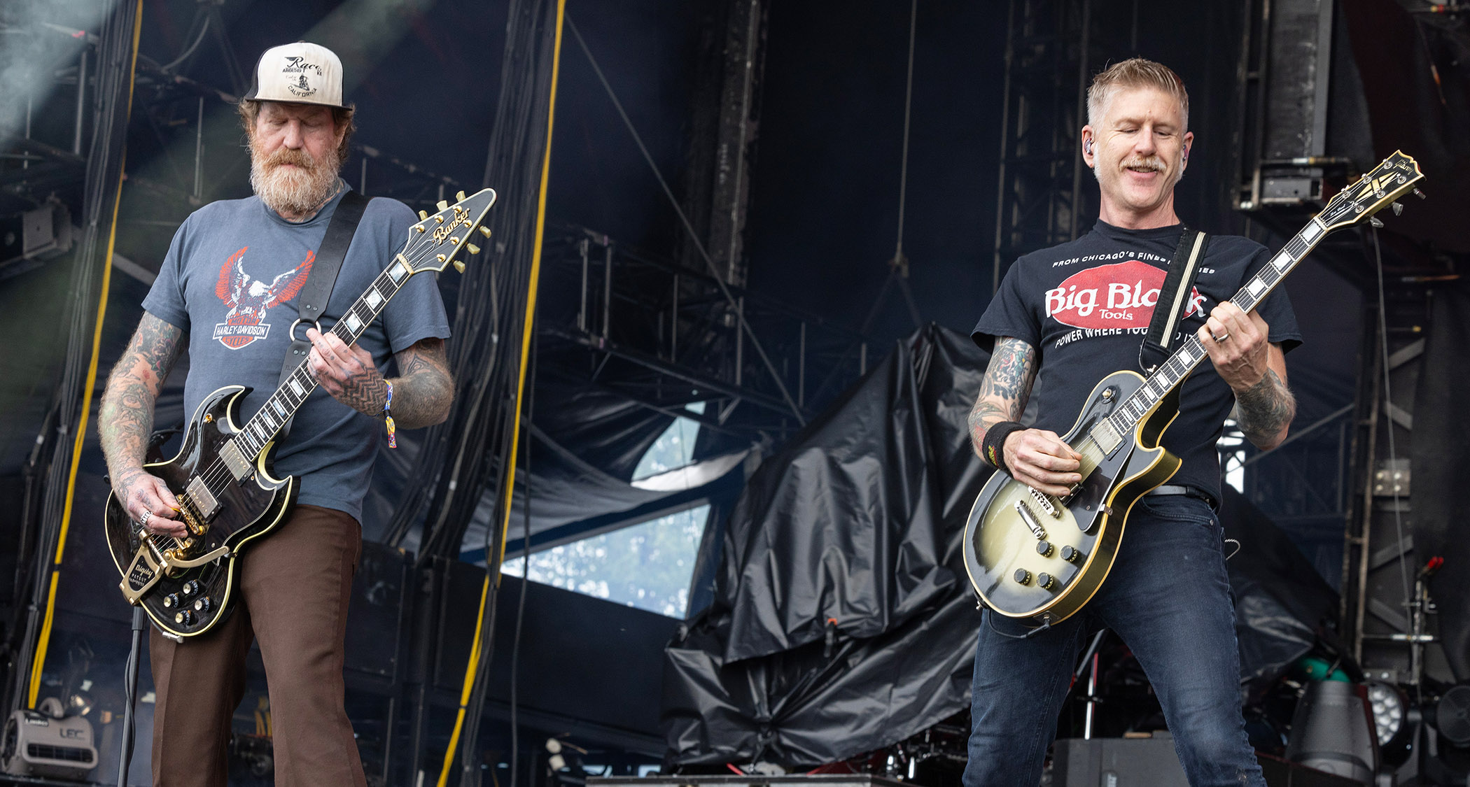 Brent Hinds and Bill Kelliher perform with Mastodon in 2024, with Hinds playing his custom Banker SG and Kelliher playing a Les Paul Custom in Silverburst.