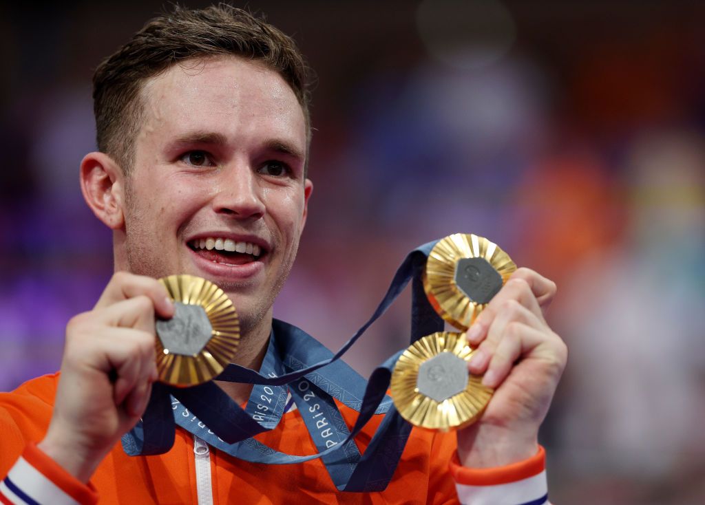 PARIS FRANCE AUGUST 11 Gold medalist Harrie Lavreysen of Team Netherlands pose on the podium with his Keirin Individual Sprint and Team Sprint gold medals after the Mens Keirin Final on day sixteen of the Olympic Games Paris 2024 at SaintQuentinenYvelines Velodrome on August 11 2024 in Paris France Photo by Jared C TiltonGetty Images