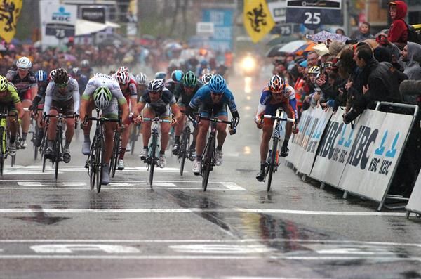 The riders sprinted to the line on wet and slippery roads