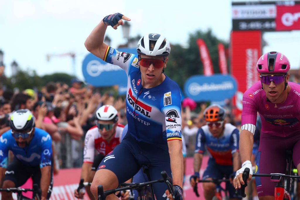 Team Soudal-Quick Step's Belgian rider Tim Merlier celebrates as he crosses the finish line to win the 18th stage of the 107th Giro d'Italia cycling race, 178km between Fiera di Primiero and Padua on May 23, 2024. (Photo by Luca Bettini / AFP)