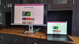 InnoCN 27M2U Mini LED monitor on a shelf next to a laptop