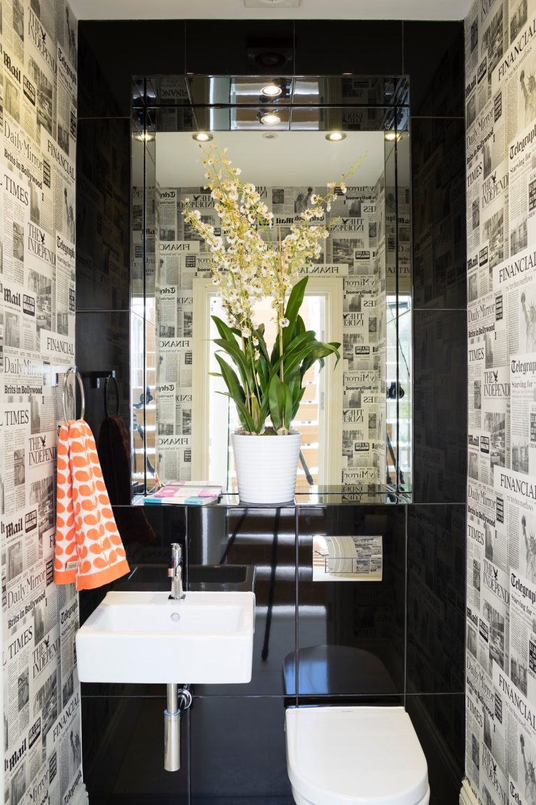 newspaper wallpaper in downstairs toilet