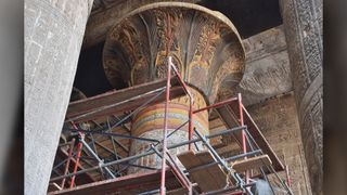 A column with plant designs that has been fully restored.
