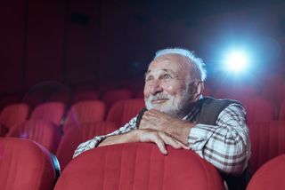 A mature man at the cinema