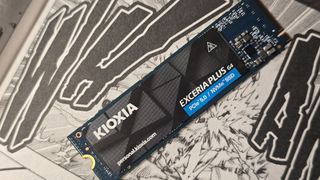 The Kioxia Exceria Plus G4 on a desk, ready to be installed inside a gaming PC.
