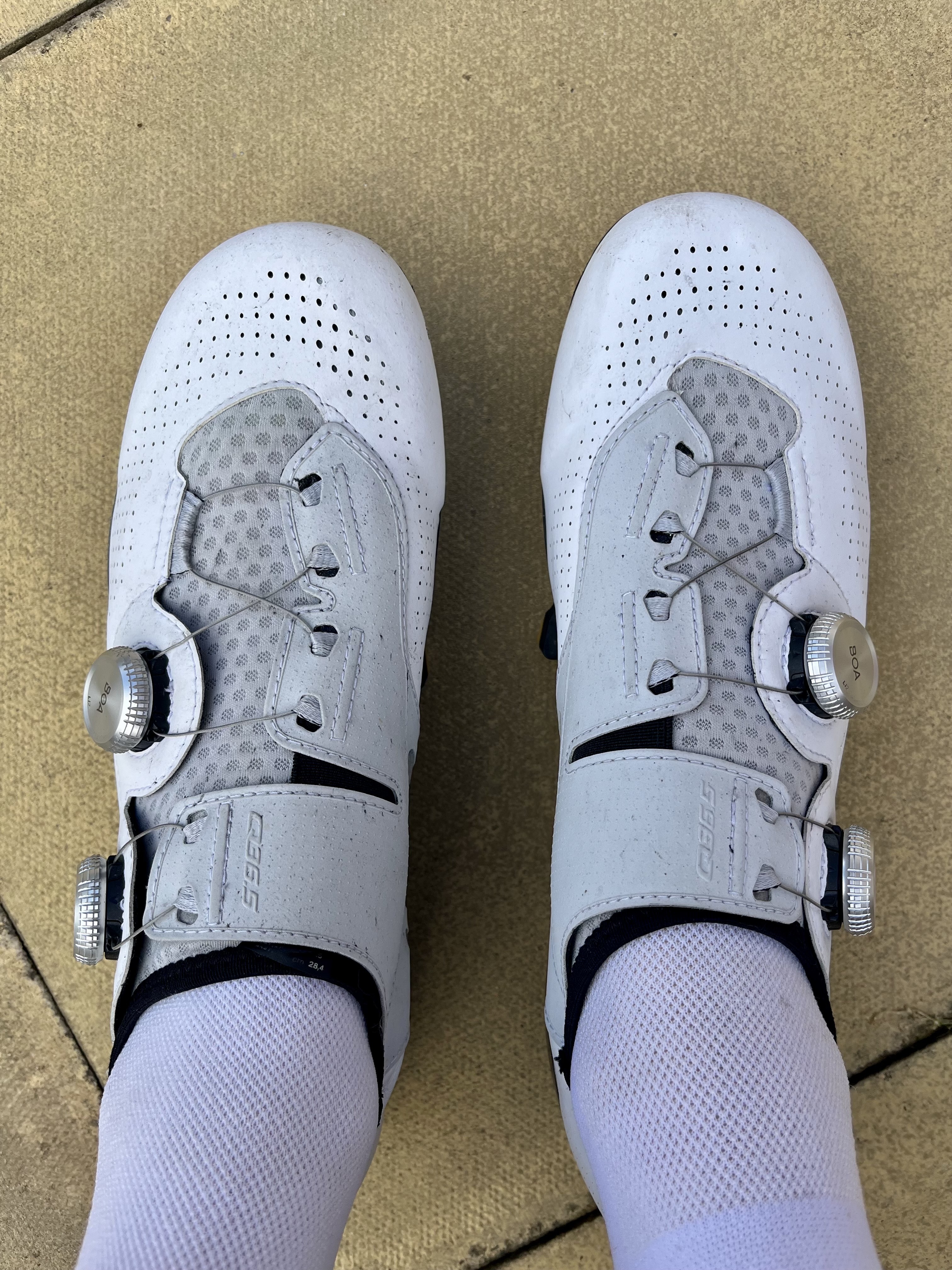 A pair of white q36.5 Unique Pro shoes