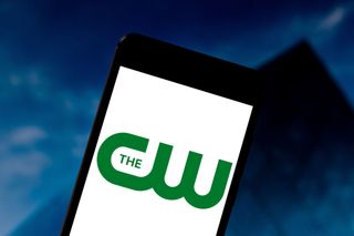 The CW logo on a phone