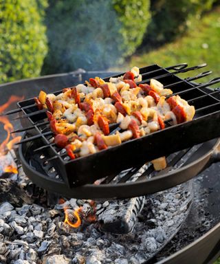 kebab rack cooking on fire pit from FirepitsUK