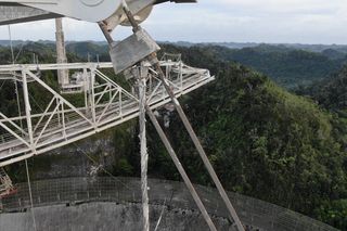 A drone view of damage to a cable at the Arecibo Observatory in Puerto Rico captured after a second cable failed on Nov. 6, 2020.