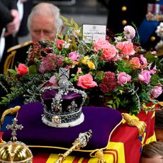 King Charles III walks alongside the coffin carrying Queen Elizabeth II with the Imperial State Crown resting on top as it departs Westminster Abbey during the State Funeral of Queen Elizabeth II on September 19, 2022 in London, England.