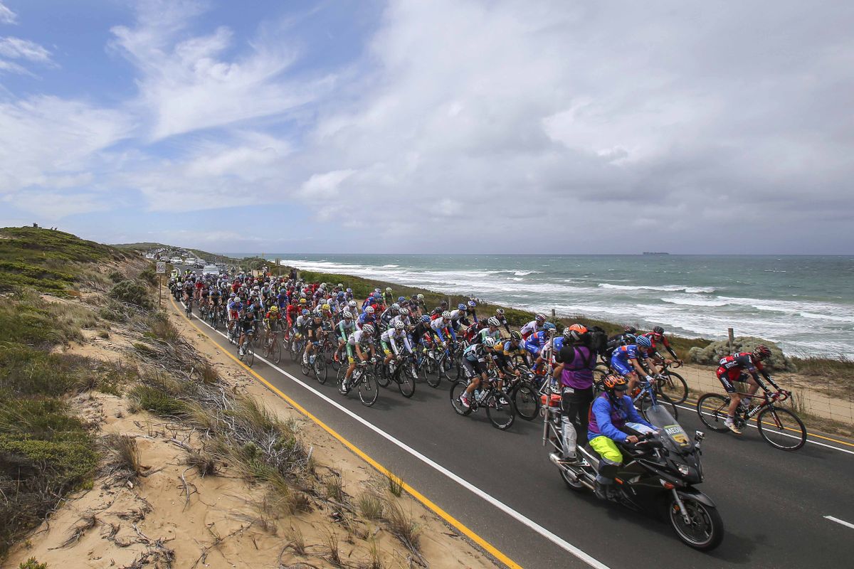 The peloton passing by the wild ocean