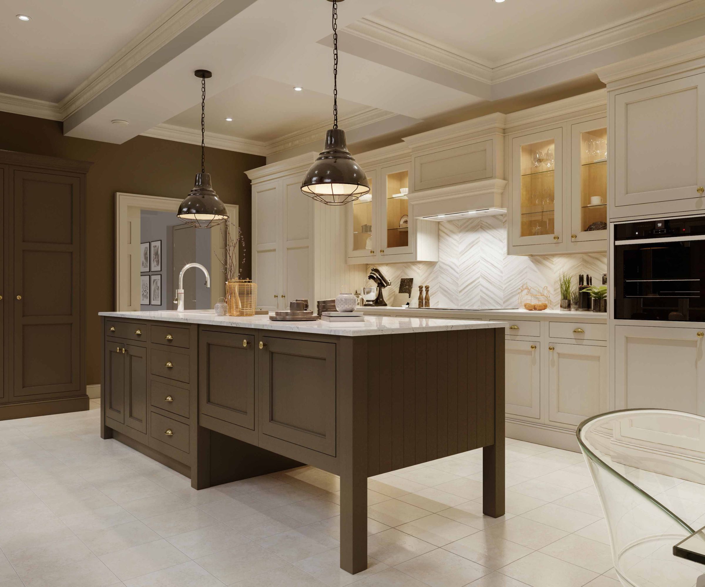 Spacious in-frame kitchen with cream and dark wood cabinetry, a large central island and marble worktops. Pendant lights hang overhead, illuminating glass display cupboards, built-in ovens and pale tiled flooring in a refined, classic interior.