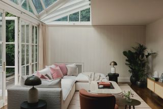 A living room with pink pillows
