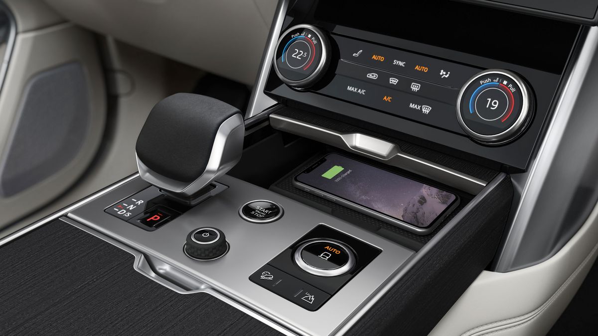 Phone sitting on an in-car wireless charging pad
