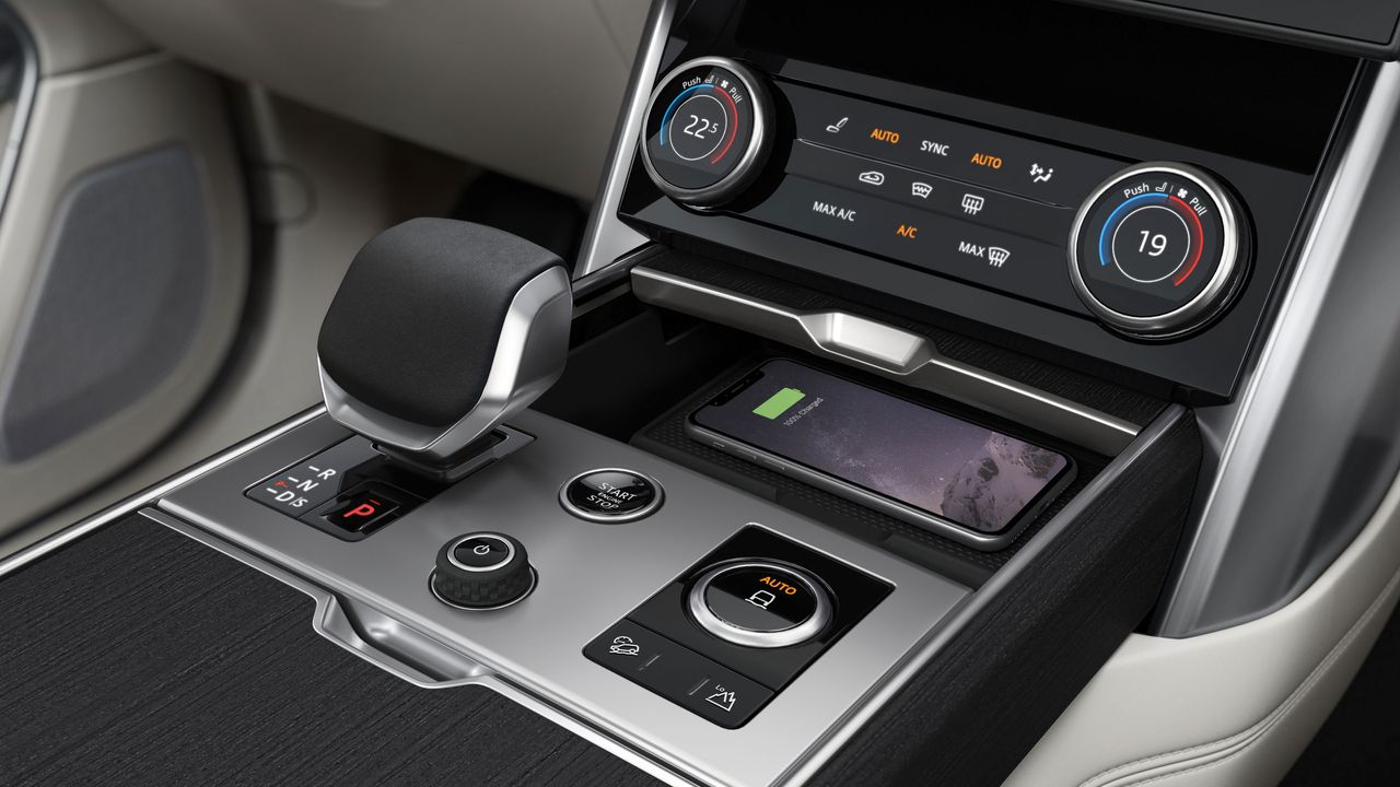 Phone sitting on an in-car wireless charging pad
