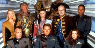 The cast of Babylon 5 pose for a promotional image in costumes and makeup.