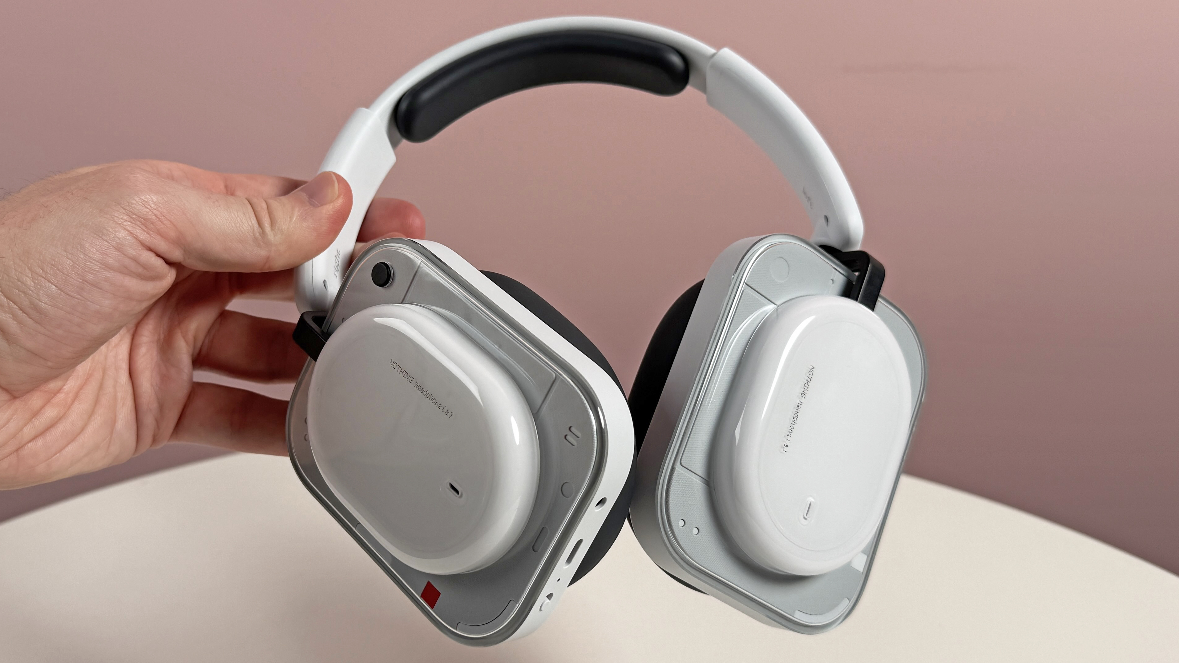 The Nothing Headphone (a) held in a man's hand