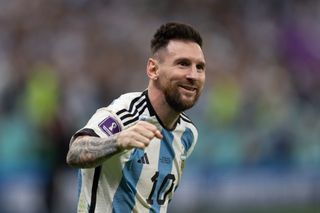 Lionel Messi celebrates Argentina's win on penalties against the Netherlands at the 2022 World Cup in Qatar.